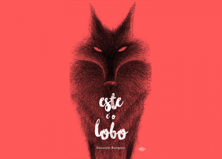 Arte de capa do livro: Este é o Lobo. A capa é vermelha e tem a ilustração de um lobo no centro. Fim da descrição.